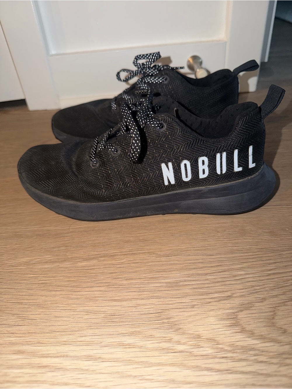 NOBULL Black Athletic Trainers with White Logo